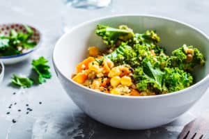 A bowl full of nutritious leafy greens, legumes and other vegetables