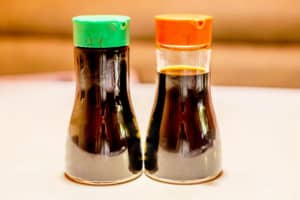 Two soy sauce bottles on the table