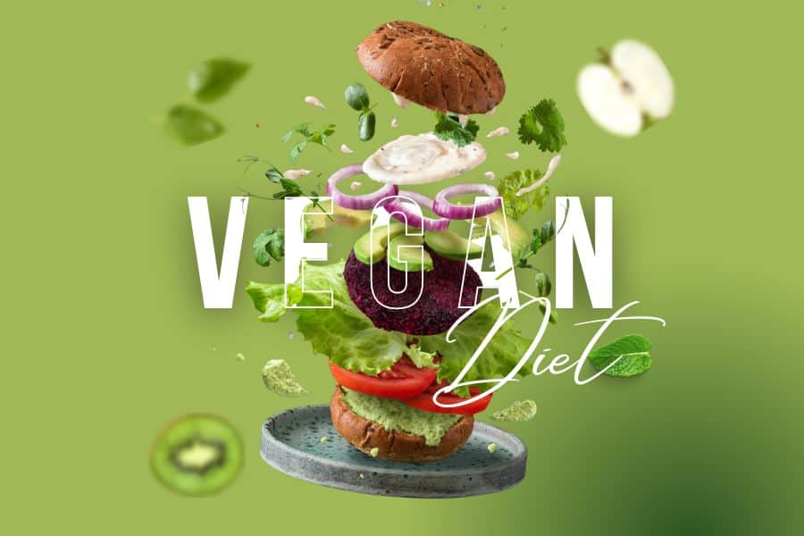 A vegan burger with lots of veggies like onion, lettuce, cabbage, tomatoes, and burger patty in it.